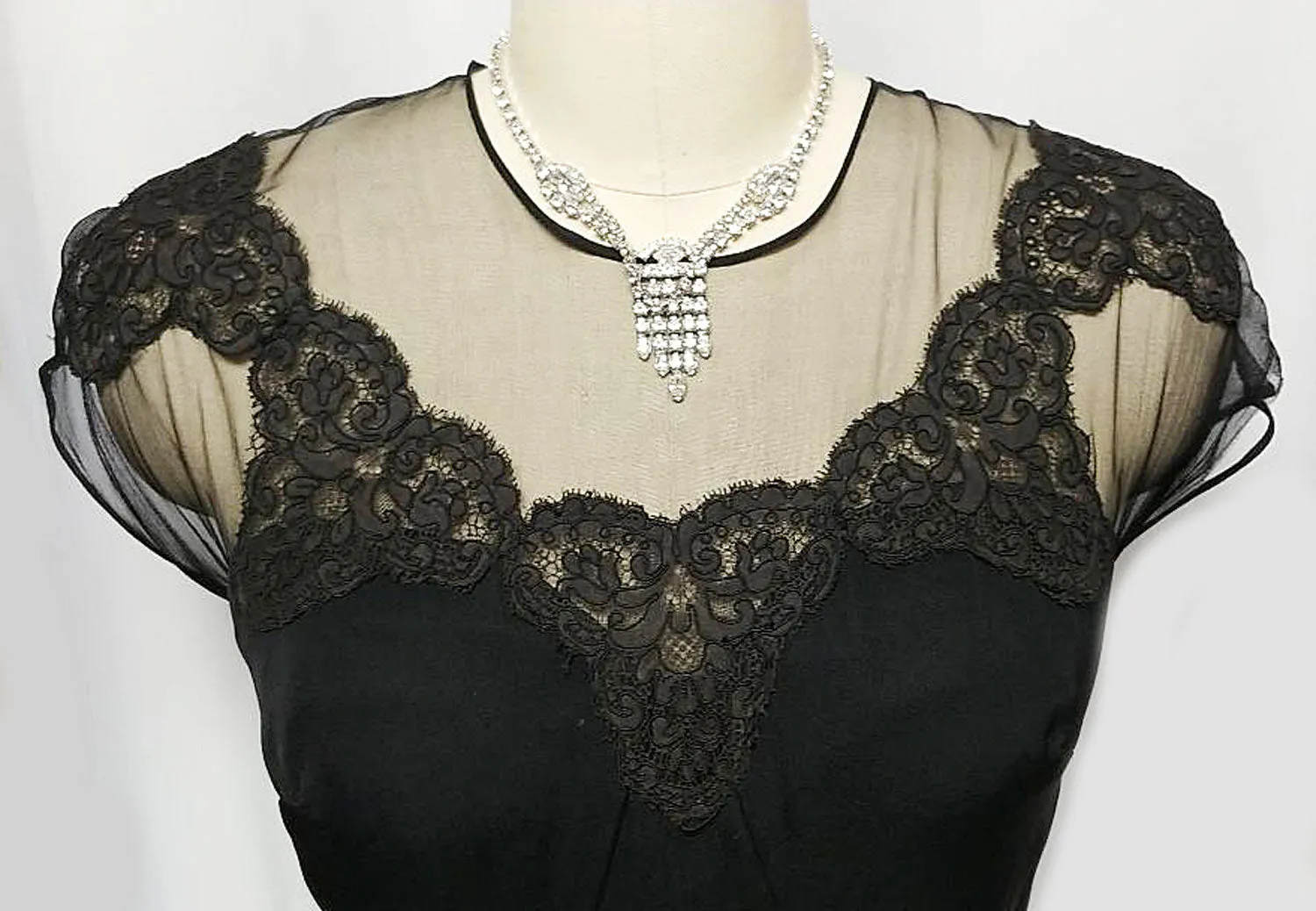 *VINTAGE "70S BLACK ILLUSION JEAN OF CALIFORNIA COCKTAIL DRESS ADORNED WITH CHANTILLY LACE